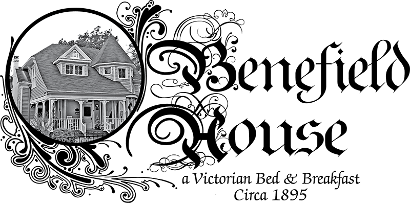 A vintage-style house with a steep roof and a front porch, set in a circular frame.